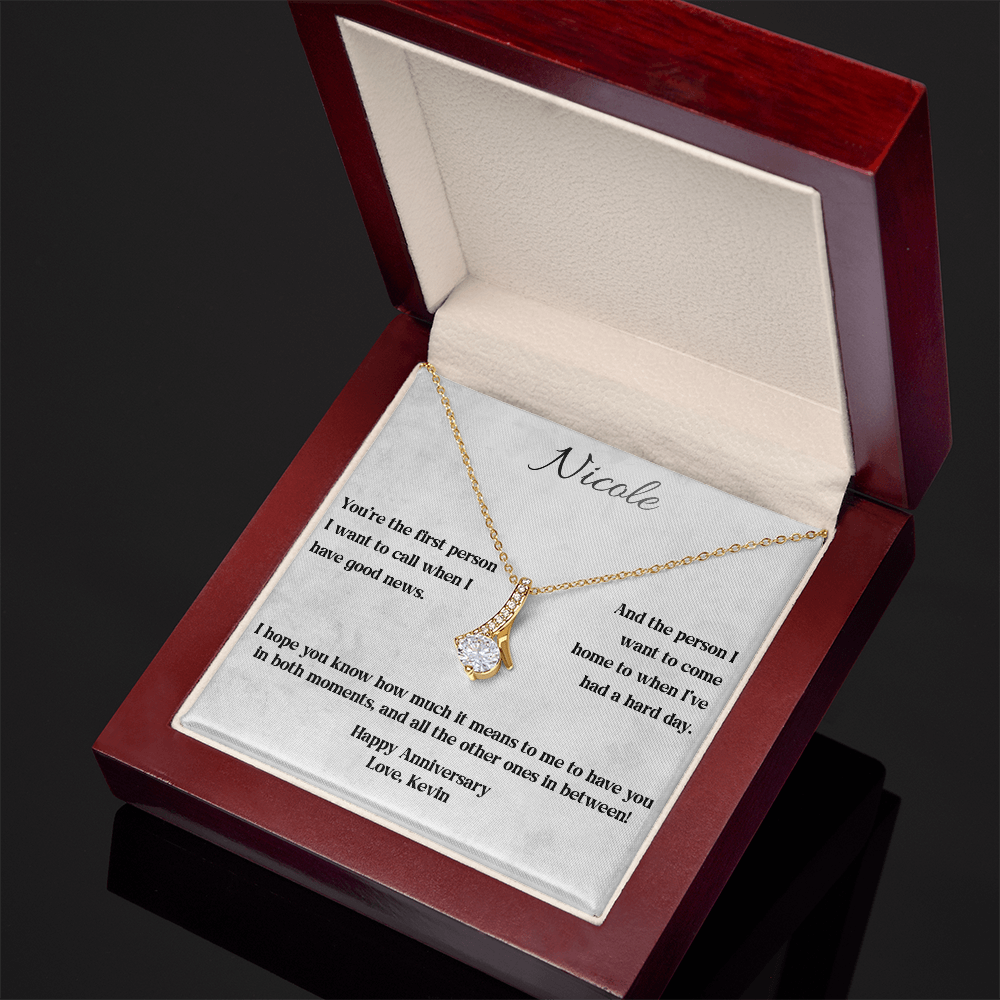 Yellow gold Alluring Beauty necklace and anniversary card in an open luxury gift box