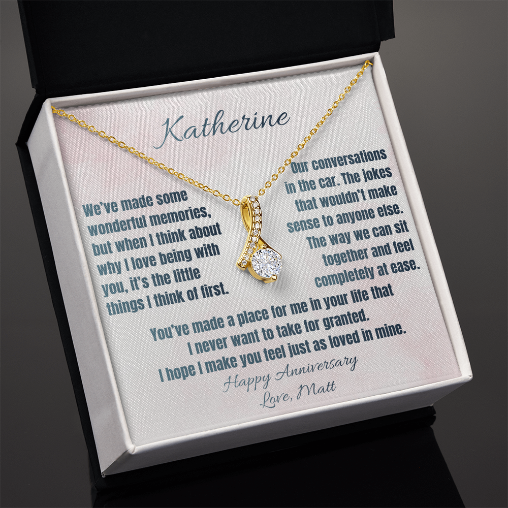 Yellow gold anniversary necklace and Katherine message card in a standard gift box