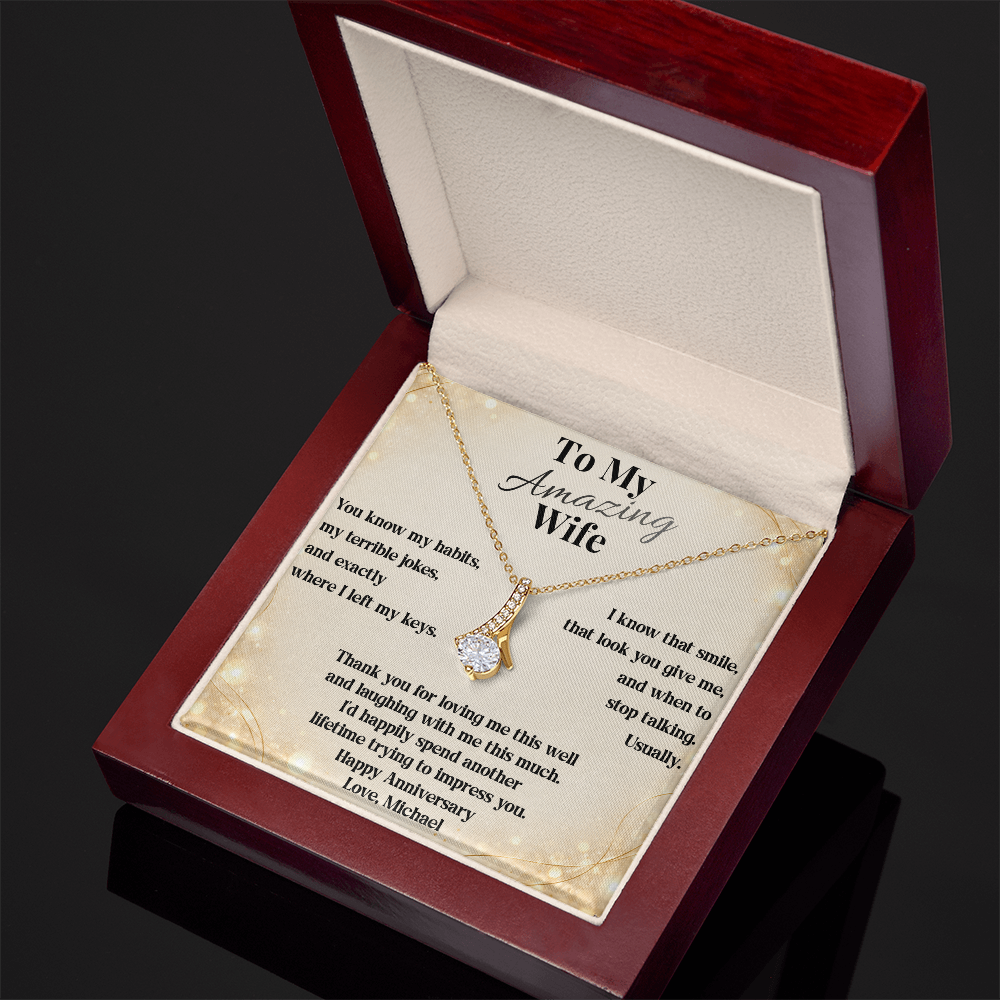 Yellow gold Alluring Beauty necklace and anniversary card in the open luxury gift box