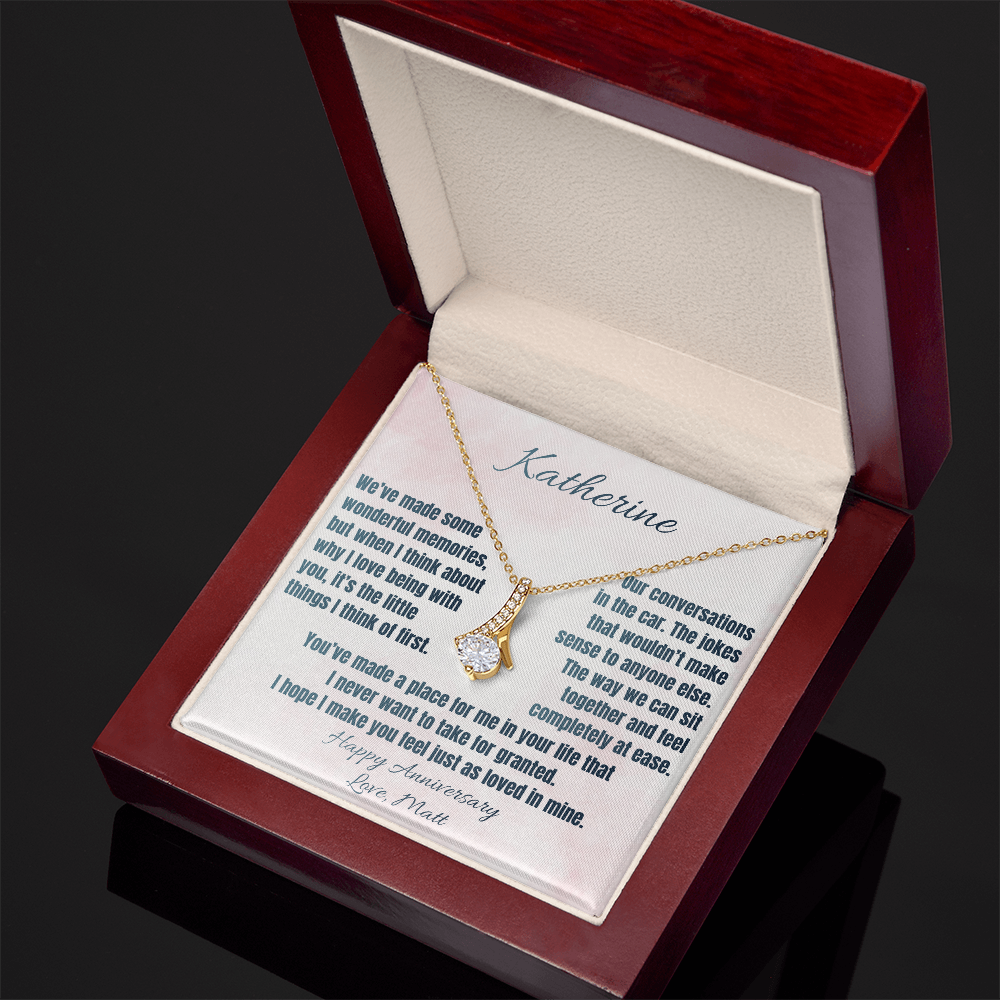 Yellow gold anniversary necklace and Katherine message card in an open luxury gift box